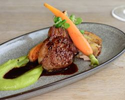 Pan fried lamb cutlet served with pea purèe, baby carrots, bacon, shallot potato terrine and minted red wine jus Pan fried lamb cutlet served with pea purèe, baby carrots, bacon, shallot potato terrine and minted red wine jus