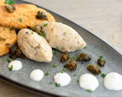 Rillettes of smoked mackerel served with horseradish cream, deep fried capers, mixed leaf salad and toasted homemade bread Rillettes of smoked mackerel served with horseradish cream, deep fried capers, mixed leaf salad and toasted homemade bread