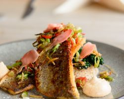 Pan seared sea bass fillets with sizzled ginger, chilli and spring onions, sesame coated tender stem broccoli, five spice rice, lemongrass syrup and soy sauce meringues Pan seared sea bass fillets with sizzled ginger, chilli and spring onions, sesame coated tender stem broccoli, five spice rice, lemongrass syrup and soy sauce meringues