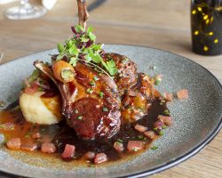 Lamb cutlets and brasied lamb faggots served with fondant potato, ratatouille, baby carrots and a red wine, tomato and chive jus Lamb cutlets and brasied lamb faggots served with fondant potato, ratatouille, baby carrots and a red wine, tomato and chive jus