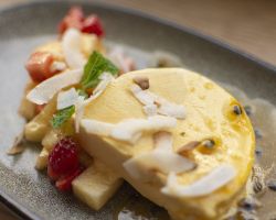 Frozen mango parfait, strawberry and pineapple salad, passionfruit coulis and toasted coconut shavings Frozen mango parfait, strawberry and pineapple salad, passionfruit coulis and toasted coconut shavings
