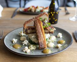 Slow braised belly of pork served with celeriac remoulade, celeriac purée, buttered spinach, apple purée, crackling and bacon popcorn Slow braised belly of pork served with celeriac remoulade, celeriac purée, buttered spinach, apple purée, crackling and bacon popcorn