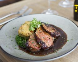 Pan fried duck breast glazed with honey and thyme, served with dauphinoise potato, celeriac purée, buttered curly kale, braised white cabbage with bacon and a red wine jus Pan fried duck breast glazed with honey and thyme, served with dauphinoise potato, celeriac purée, buttered curly kale, braised white cabbage with bacon and a red wine jus