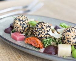 Goats’ cheese truffles coated in black onion and sesame seeds served with roasted beetroots, beetroot purée, puy lentil salad, balsamic dressing and Grana Padano Tipo shavings (Vegan without cheeses) Goats’ cheese truffles coated in black onion and sesame seeds served with roasted beetroots, beetroot purée, puy lentil salad, balsamic dressing and Grana Padano Tipo shavings (Vegan without cheeses)